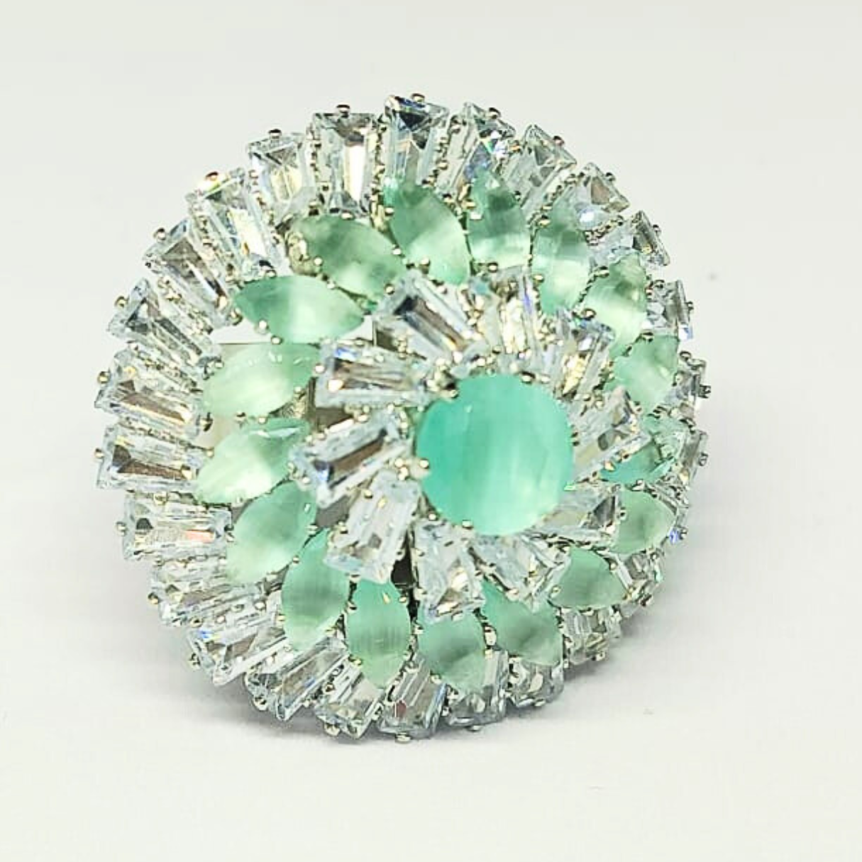 Designer silver cocktail ring with mint green stones and baguette-cut zircons