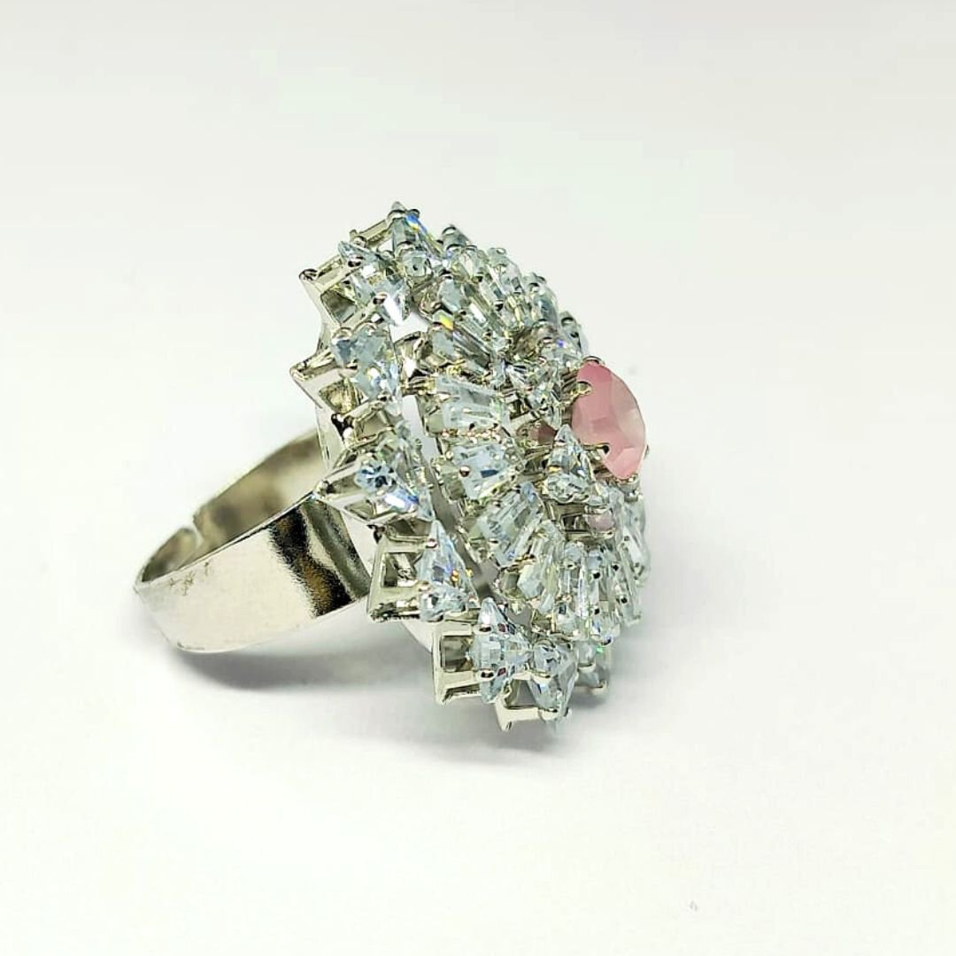 Silver floral designer ring with white stones and pink center gem by Sarvratna Jewellery
