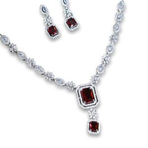 Elegant silver necklace and earring set with ruby red stones and diamond-like embellishments