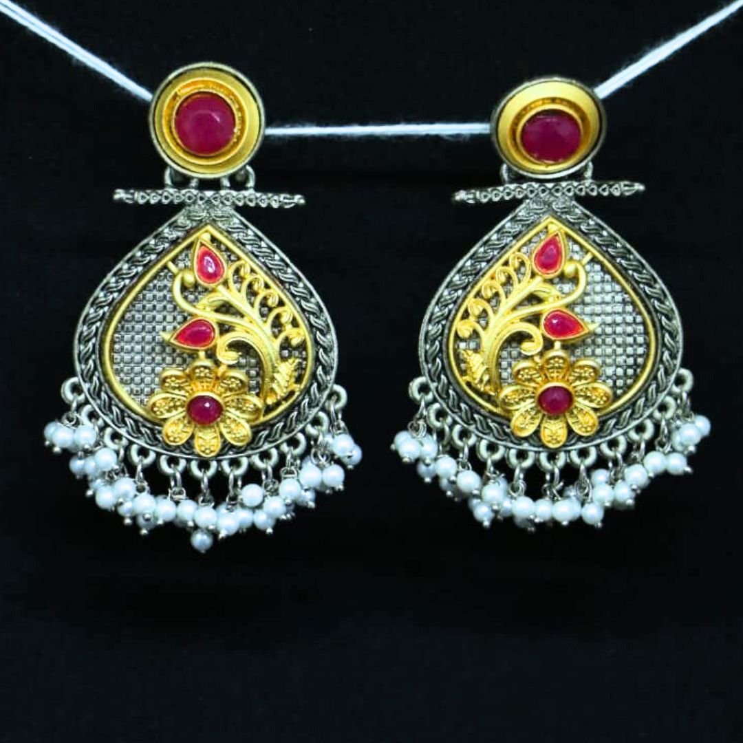 Oxidised chandbali earrings with golden floral design, red stones, and pearl drops by Sarvratna Jewel
