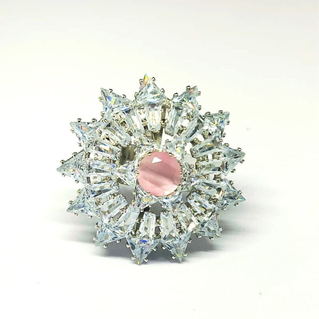 Silver floral designer ring with white stones and pink center gem by Sarvratna Jewellery